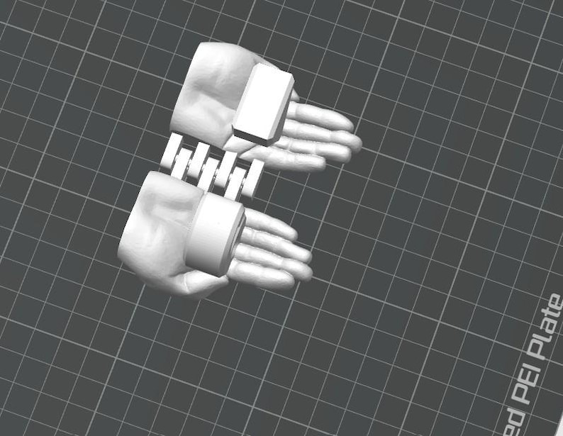 May include: A 3D-rendered image of two hands, each wearing a white cuff with a rectangular top. The hands are connected by a series of white rectangular bars. The background is a gray grid.