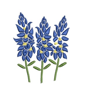 May include: Three blue and yellow embroidered flowers with green stems on a white background.