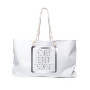 May include: White canvas tote bag with rope handles and a black and white graphic that says "ORIENT POINT" in a box.