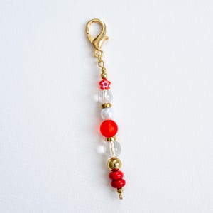 Bag Charm with Red Flower and Gold Accents