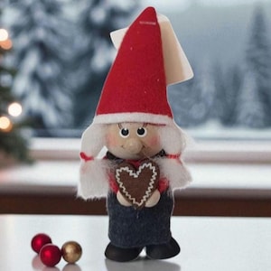 Skandinvisk Hemslojd Tomte Girl Elf Red and Dark Gray Baker Holding a Heart Shaped Cookie Handmade in Sweden 5 in x 1.5 in
