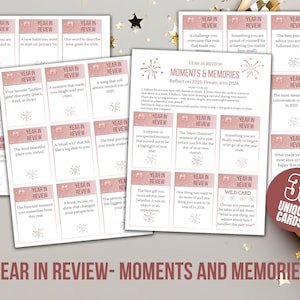 May include: A set of 33 unique cards for a 'Year in Review' game. The cards are light pink with white text, featuring prompts to reflect on the past year and dream about the future. The title 'Year in Review - Moments and Memories' is displayed.