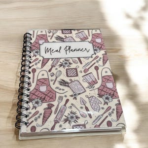 Weekly Meal Planner Journal with a grocery list,pantry/fridge/freezer tracker, recipe cards, and meal review pages. Perfect for meal prep, reducing food waste, and staying organized in the kitchen—ideal for families, meal prep or busy individuals.
