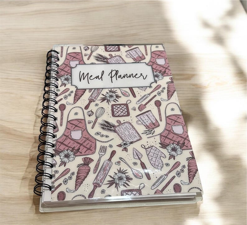 Weekly Meal Planner Journal with a grocery list,pantry/fridge/freezer tracker, recipe cards, and meal review pages. Perfect for meal prep, reducing food waste, and staying organized in the kitchen—ideal for families, meal prep or busy individuals.