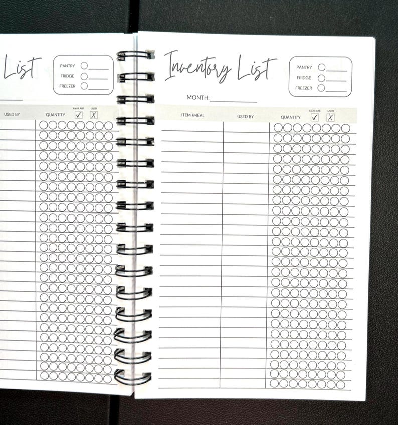 May include: A spiral-bound inventory list planner with white pages and black ink. The layout features a header labeled Inventory List, a month field, and sections for pantry, fridge, and freezer. Columns include item/meal, used by, quantity, and check boxes.