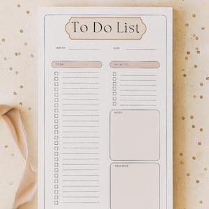 May include: A white To Do List notepad with a beige border and text. The notepad includes sections for month, date, to-do items, priorities, notes, and reminders. The background is a light beige with gold confetti.