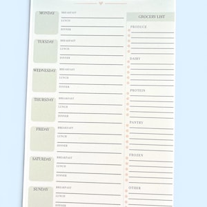 May include: A rectangular weekly meal plan notepad with a white background and sage green accents. The header reads WEEKLY MEAL PLAN. It features sections for Monday through Sunday, each with lines for breakfast, lunch, and dinner, plus a grocery list.