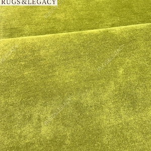 and-tufted solid green wool area rug with plush soft pile, modern minimalist design, perfect for living room, bedroom or contemporary interiors.