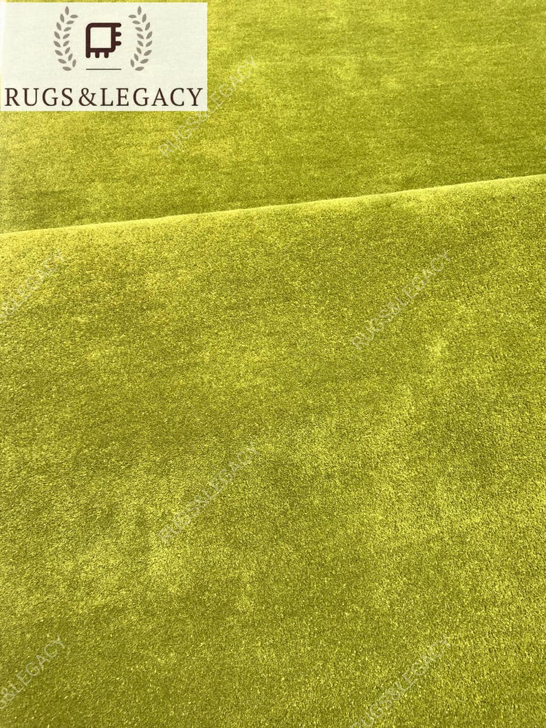 and-tufted solid green wool area rug with plush soft pile, modern minimalist design, perfect for living room, bedroom or contemporary interiors.