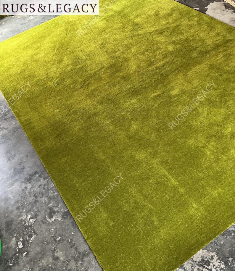 and-tufted solid green wool area rug with plush soft pile, modern minimalist design, perfect for living room, bedroom or contemporary interiors.