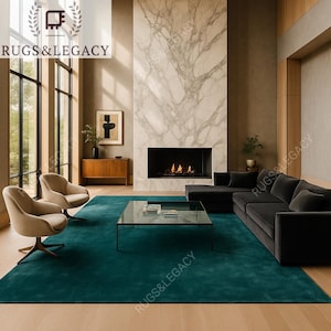 Hand-tufted emerald green area rug 8x10 in a modern living room setting.
