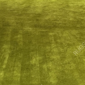 and-tufted solid green wool area rug with plush soft pile, modern minimalist design, perfect for living room, bedroom or contemporary interiors.