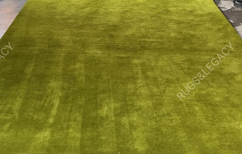 and-tufted solid green wool area rug with plush soft pile, modern minimalist design, perfect for living room, bedroom or contemporary interiors.