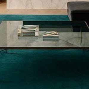 Top down view of solid emerald color minimalist floor carpet.