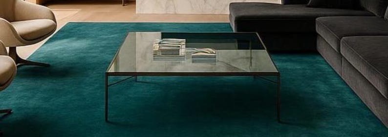 Top down view of solid emerald color minimalist floor carpet.