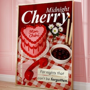 May include: A framed print with a red and white checkered background features a heart-shaped cake with "Mon Ch&eacute;ri" on it, cherries, daisies, candles, and a red telephone. The text "Midnight Cherry" and "For nights that can't be forgotten" are also visible.