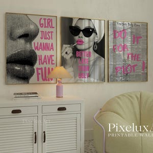 May include: Three framed wall art prints with gold frames. One features a black and white image of lips with the text "GIRL JUST WANNA HAVE FUN" in pink. Another shows a woman applying lipstick with the text "BETTER LATE THAN UGLY". The third print has newspaper print with the text "DO IT FOR THE PLOT!"