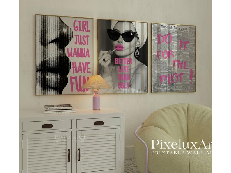 May include: Three framed wall art prints with gold frames. One features a black and white image of lips with the text "GIRL JUST WANNA HAVE FUN" in pink. Another shows a woman applying lipstick with the text "BETTER LATE THAN UGLY". The third print has newspaper print with the text "DO IT FOR THE PLOT!"