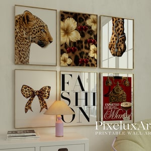 May include: A collection of framed wall art with a leopard print theme. The art includes images of a leopard's face, a bow, flowers, and the word "FASHION". One piece features a red background with a martini glass and the words "Espresso Martini".