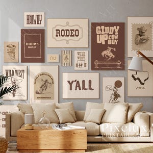 May include: A gallery wall of framed prints with a Western theme, including cowboy illustrations and phrases such as "Howdy" and "Y'all." The prints are in brown and beige tones, creating a rustic feel. The artwork is displayed above a beige sofa, creating a cozy atmosphere.