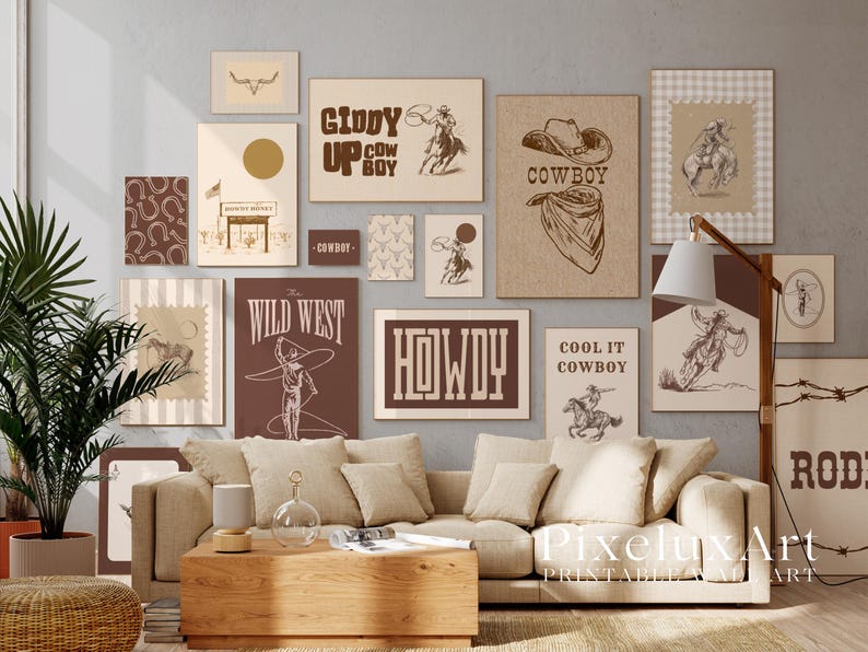 May include: A gallery wall of framed art prints with a Western theme, featuring cowboy illustrations and typography in a neutral colour palette. Prints include phrases like "Giddy Up Cow Boy", "Wild West", and "Howdy". The artwork is displayed above a beige sofa.