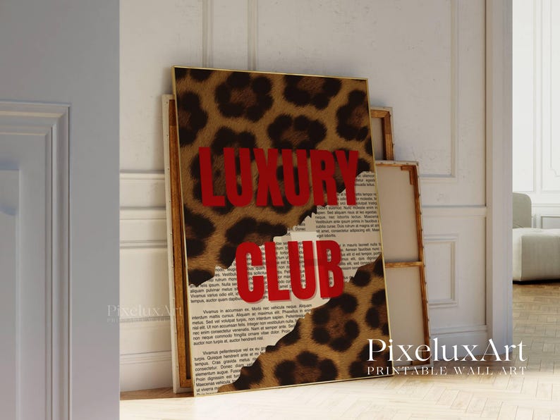 May include: A framed print with a leopard print design and the words "LUXURY CLUB" in red. The print is layered over a background of text. The artwork is leaning against a white wall.
