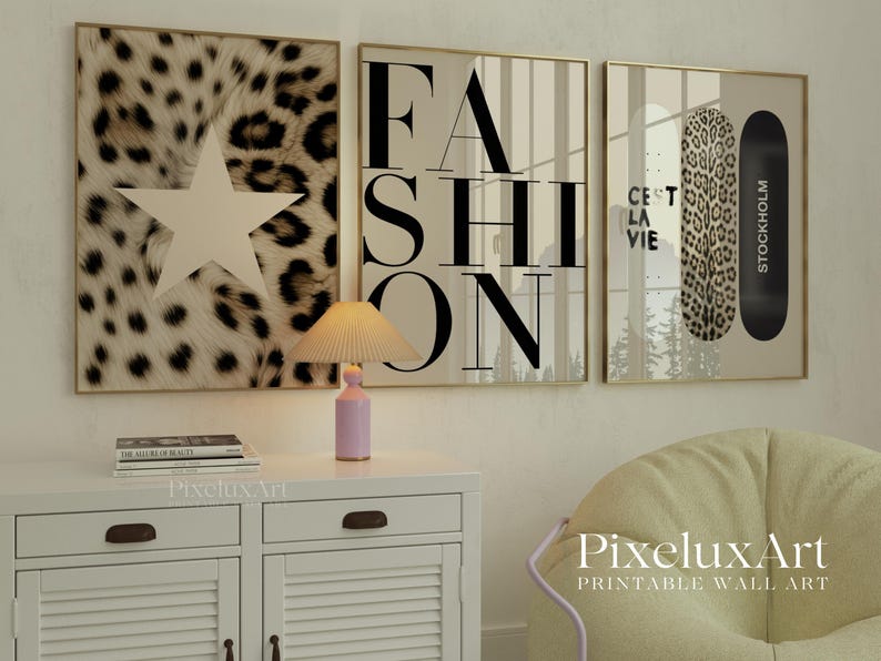 May include: Three framed wall art prints. The first features a star on a leopard print background. The second says "FASHION" in large black letters. The third has a leopard print skateboard and the text "C'est la vie" and "Stockholm".