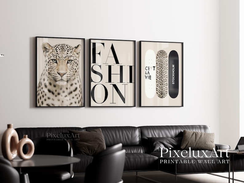 May include: Three framed wall art prints. The first features a leopard's face. The second says "FASHION" in large black letters. The third shows two skateboards, one with leopard print, and the text "C'est la vie" and "Stockholm".