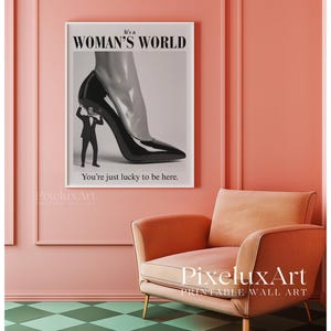 May include: A framed print with the text "It's a Woman's World" and "You're just lucky to be here." The artwork depicts a high-heeled shoe with a man in a suit beneath it. The room has a peach-colored wall and a green and white checkered floor.