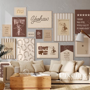 May include: A gallery wall of framed prints with a Wild West theme, featuring text such as "Yeehaw" and "Hold Your Horses." The prints showcase cowboy imagery, horseshoes, and vintage designs in brown and beige hues. The artwork adorns a living room.