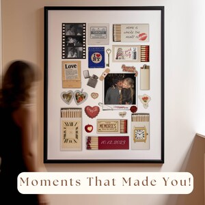 May include: A framed collage featuring various mementos, including photos, matchboxes, and small decorative items. The collage includes the text "Moments That Made You!" and a date, "10.12.2023". The items are arranged on a white background.