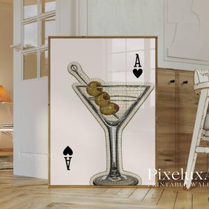 May include: Printable wall art featuring a martini glass with olives and the Ace of Spades. The martini glass is filled with a mosaic pattern. The artwork is framed in a gold-colored frame. The text "PixeluxArt PRINTABLE WALL ART" is visible.