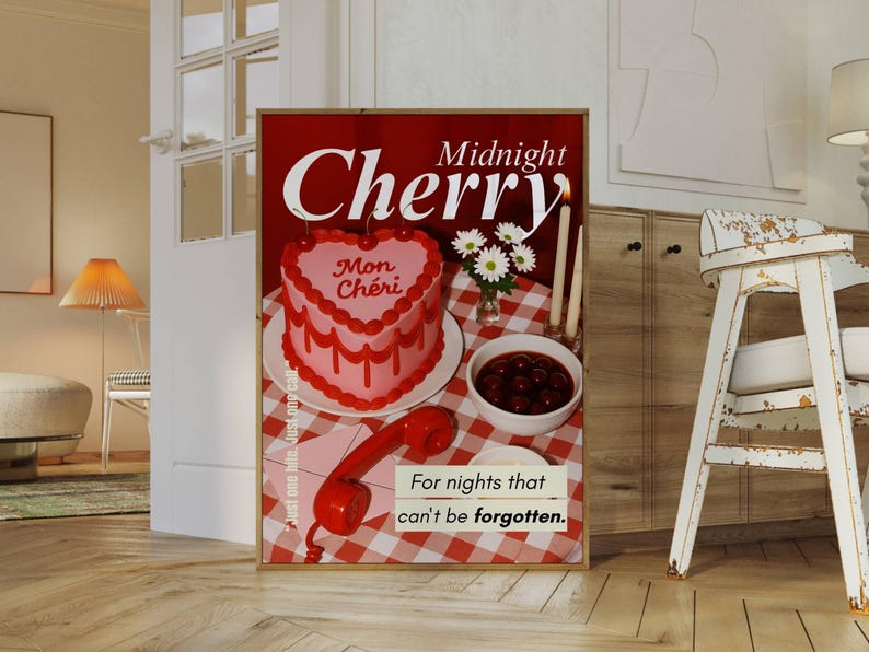 May include: A framed poster with a red background features the words "Midnight Cherry" and a heart-shaped cake with "Mon Ch&eacute;ri" written on it. A bowl of cherries, a red phone, and the text "For nights that can't be forgotten" are also visible.