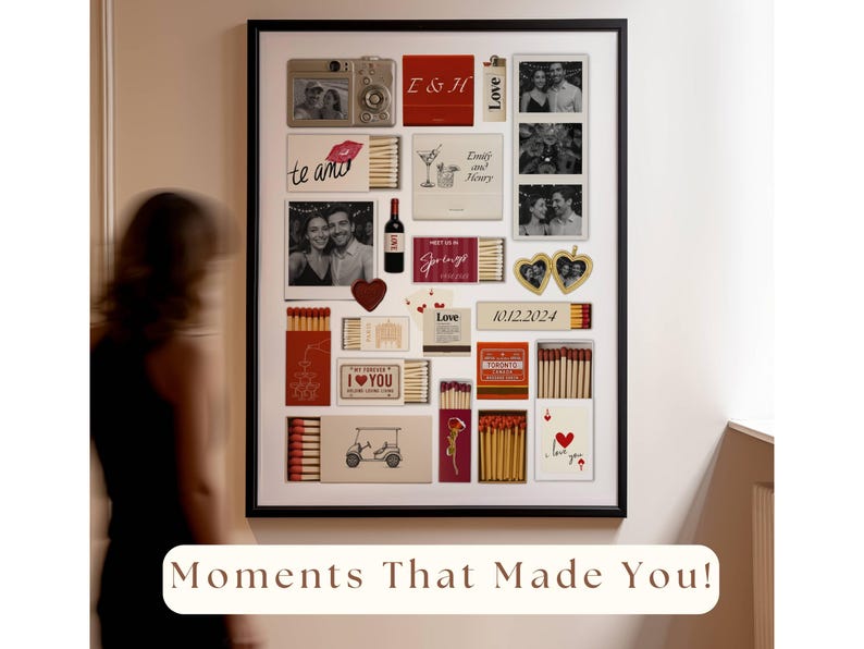 May include: A collage of photos and matchboxes in a black frame. The photos show a couple and the matchboxes have various designs, including hearts, flowers, and the text "te amo". The frame is hanging on a white wall. The text "Moments That Made You!" is written below the frame.