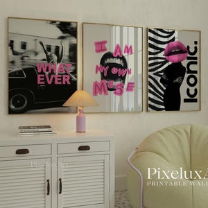 May include: Three framed wall art prints with gold frames. The prints feature the phrases "WHATEVER", "I AM MY OWN MUSE", and "ICONIC" in pink text. The middle print shows an open mouth, and the last print has a woman's silhouette with a pink lip.