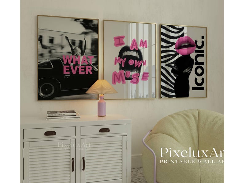May include: Three framed wall art prints with gold frames. The prints feature the phrases "WHATEVER", "I AM MY OWN MUSE", and "ICONIC" in pink text. The middle print shows an open mouth, and the last print has a woman's silhouette with a pink lip.