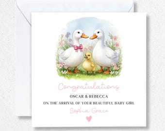 May include: A greeting card with a watercolor illustration of two white ducks and a yellow duckling in a grassy field with flowers. The card reads "Congratulations" and includes names and a baby girl's name.
