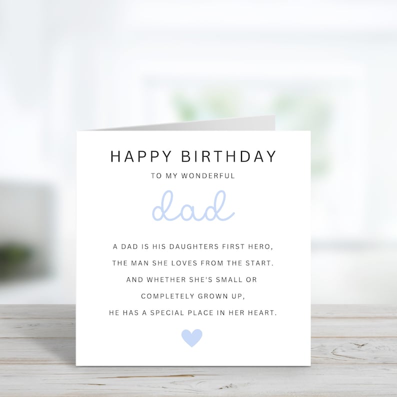 May include: A white card with a blue heart and the text "Happy Birthday to my wonderful dad. A dad is his daughters first hero, the man she loves from the start. And whether she's small or completely grown up, he has a special place in her heart."