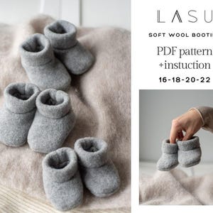 May include: A PDF pattern and instructions for knitting soft wool booties in sizes 16-18-20-22. The image shows three pairs of gray booties on a beige blanket and a hand holding a pair of gray booties.
