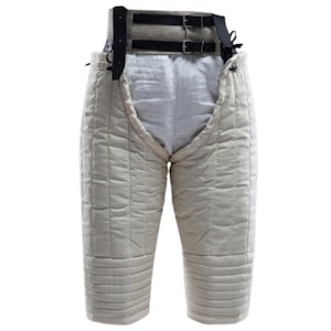 May include: White padded leg armor with a black leather belt and buckles. The armor is designed to protect the legs and thighs during combat or reenactment.