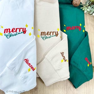 Merry Christmas Embroidered Sweatshirt with Name on Sleeve, Christmas Crewneck Hoodie, Holiday Sweatshirts for Women, Christmas Gifts