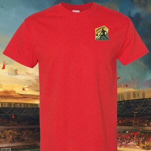 May include: Red t-shirt with a small embroidered patch on the left chest. The patch is a vintage-style design with a football player and the words "Unbreakable Wall" and "State Tale".