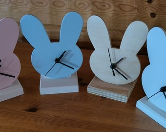 SMALL BUNNY CLOCK. Sweet Passage of Time with Bunny Clock. The clock can be attached to the wall or placed on a table in its own stand.