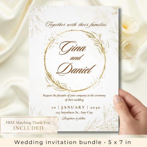 May include: A white wedding invitation with gold text and accents. The invitation features the names "Gina and Daniel" inside a gold circular wreath. The date is January 10, 2030. The invitation is 5 x 7 inches.