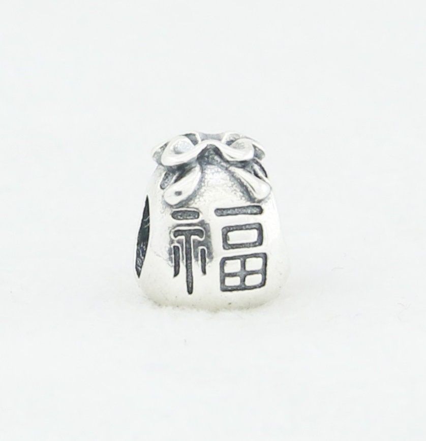 Pandora chinese money bag charm best sale