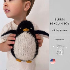 May include: A handmade penguin toy with a black head and wings, a white body, and yellow feet and beak. The text "BLUUM PENGUIN TOY knitting pattern" is displayed on the right side of the image. The toy is held by a person.