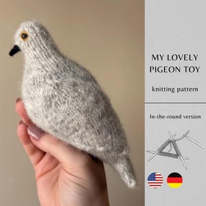May include: A handmade, knitted gray pigeon toy with a black beak and yellow eye. The text "MY LOVELY PIGEON TOY" and "knitting pattern" are visible. The image also includes a knitting diagram and flags.