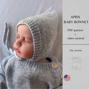 May include: A baby in a light grey knitted bonnet and sweater. The bonnet has a pointed top and ties. The sweater has wooden buttons. Text on the right reads "APRIL BABY BONNET" and "PDF pattern + video tutorial".