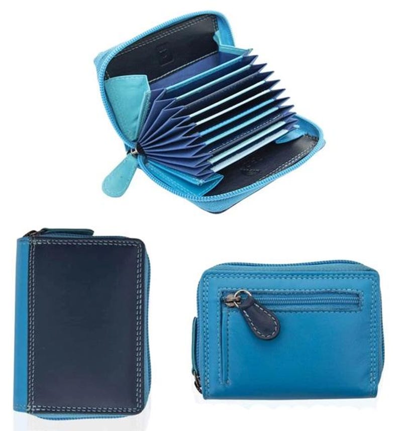 May include: A collection of blue leather wallets. One wallet is open, revealing multiple card slots. Another wallet is closed, showing a dark blue front with light blue sides. The third wallet is a lighter blue with a zipper and a small pocket.