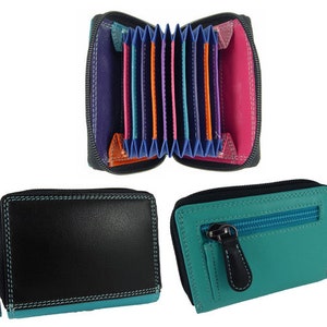 May include: Three colorful leather wallets. One is open, revealing card slots in various colors. The other two are closed, one black with teal trim and the other teal with a black zipper pull. All have zippers.